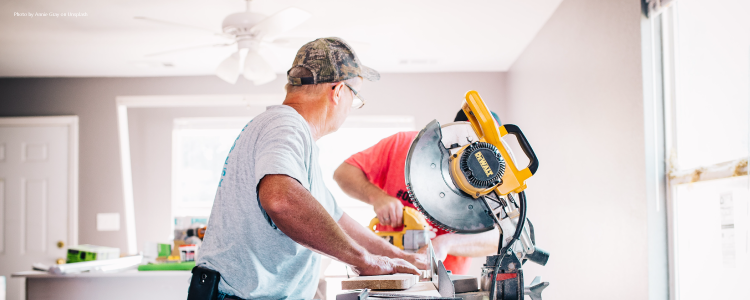 two men doing home repairs