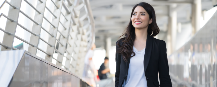woman at international airport moving overseas for work