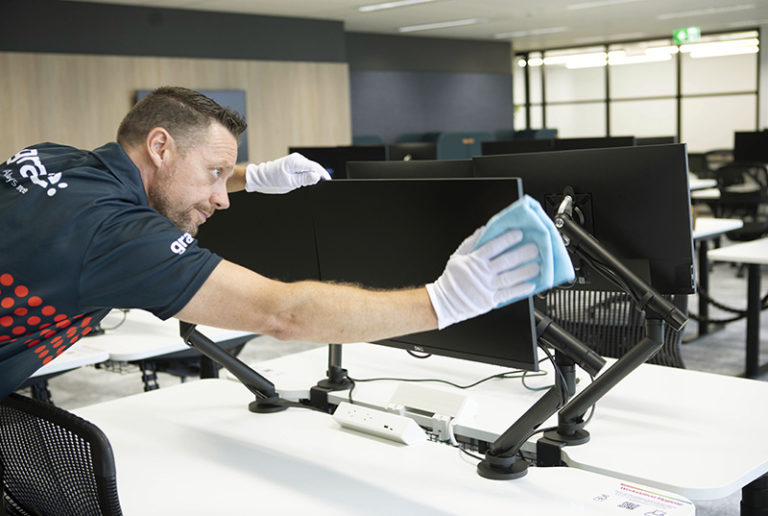 business relocation specialist cleaning the computer