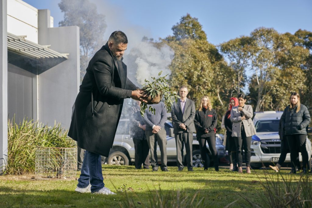 Grace unveils an Indigenous artwork created by artist, Robert Young