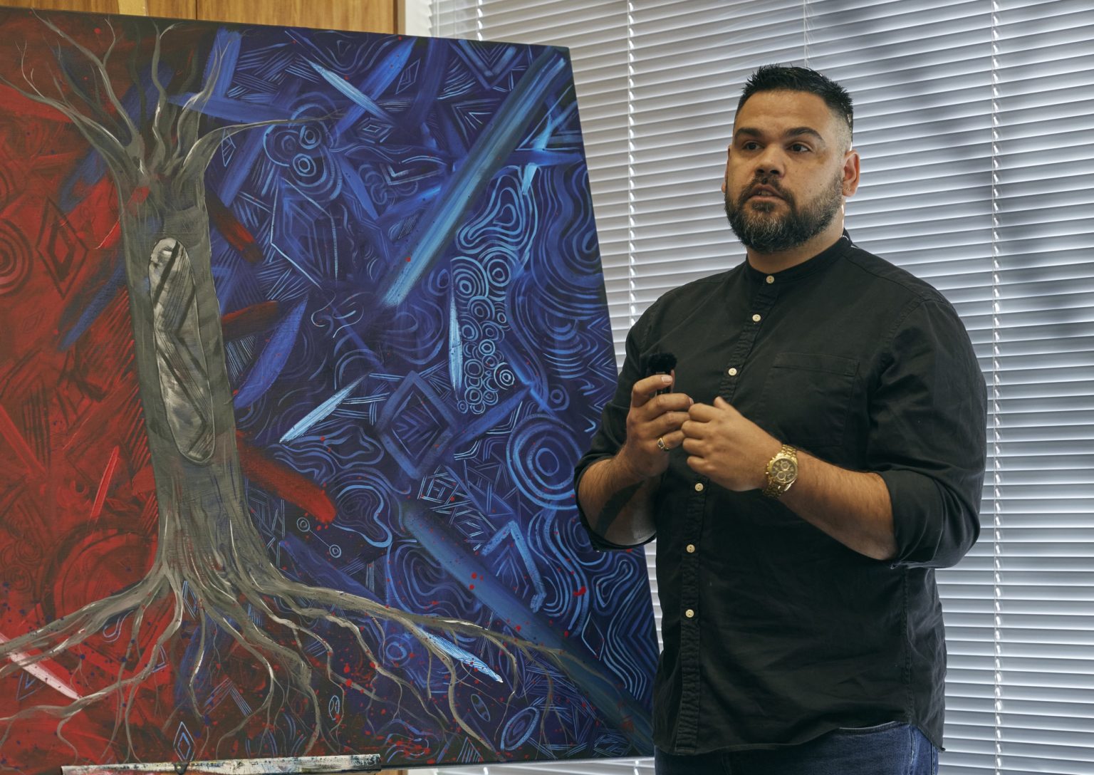 Grace unveils an Indigenous artwork created by artist, Robert Young