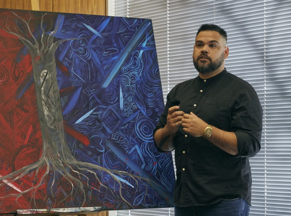 Grace unveils an Indigenous artwork created by artist, Robert Young