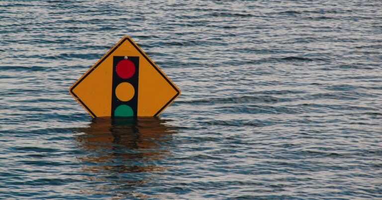 Submerged traffic light sign in deep water