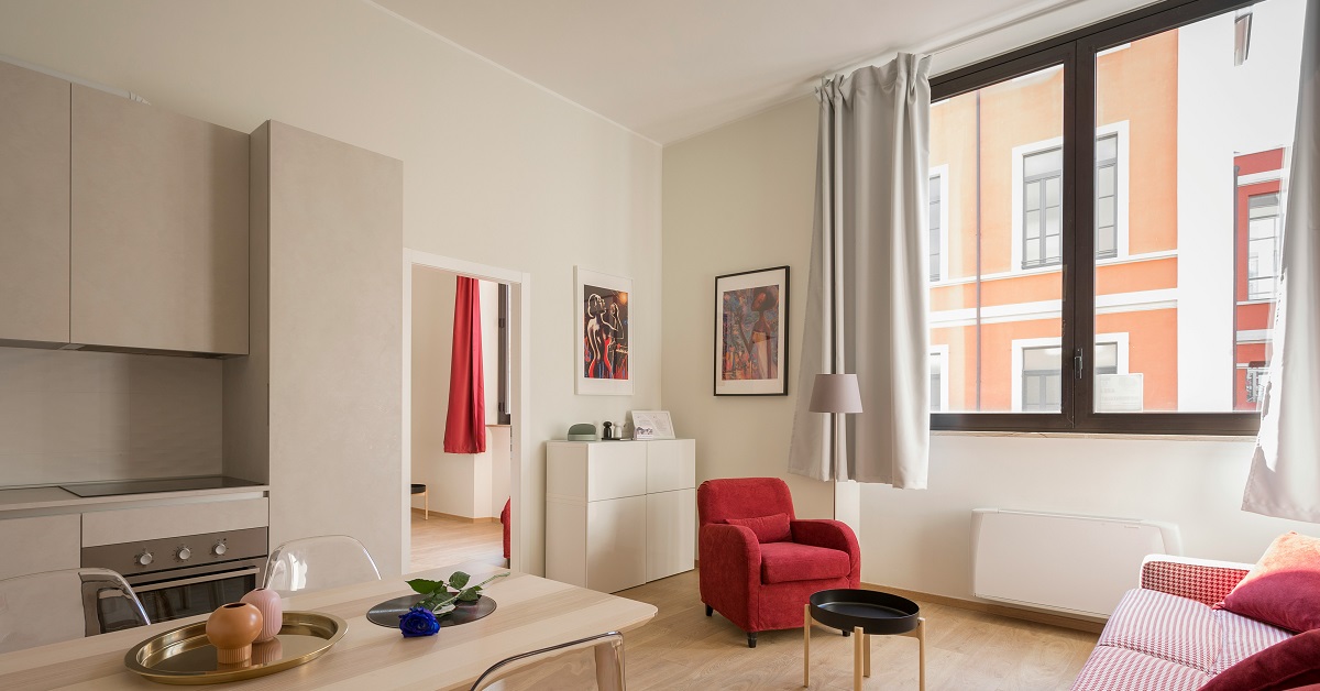 Red couch in a home with Smart Ventilation System for air quality