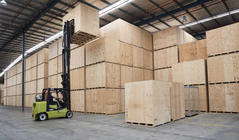 Grace staff loading wooden box pallet in a warehouse Storage