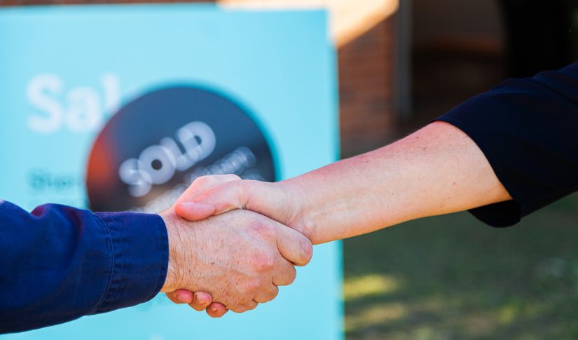 real estate agent shaking hands with customer Real Estate