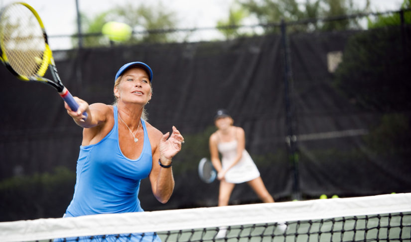 Womens doubles match tennis volley Partner Support